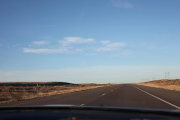 Blue skies and an empty highway road