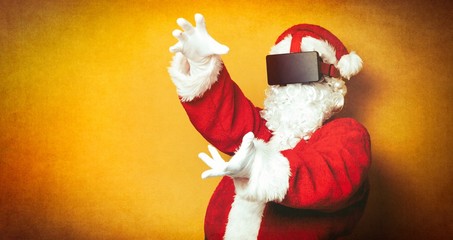 Funny Santa Claus have a joy with VR glasses