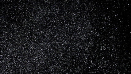 Snowfall Bokeh Lights on Black Background, Shot of Flying Snowflakes in the Air