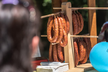 Selling sausage items at a street party