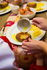 children learn how to cook stuffed potatoes in class