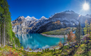Fototapeta na wymiar Amazing tourquise Oeschinnensee lake with waterfalls in Swiss Alps, Berner Oberland, Switzerland
