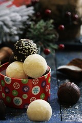 Variety of Dark and White chocolate Truffles on festive Xmas background