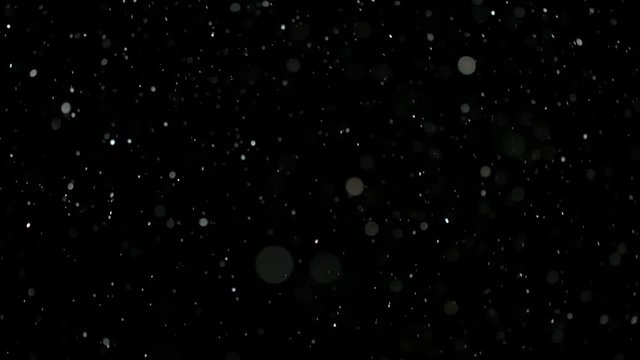 Slow Motion Snowfall Bokeh Lights on Black Background, Shot of Flying Snowflakes in the Air