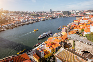 Obraz premium Top view on the Douro river with Ribeira region in the old town of Porto city, Portugal