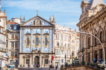 Fototapeta na wymiar Street view on the facade with beautiful blue tiles of Congregados church in Porto city, Portugal