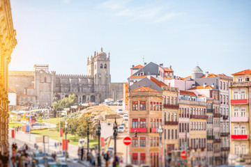 Cityscape view with beautiful old buildings and Se cathedral in Porto city. Image with tilt-shift blurred technic