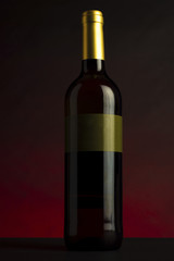 wine bottle with red and black background and label without text