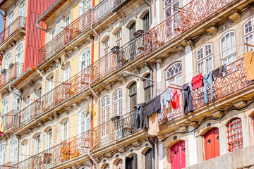 Fototapeta na wymiar Street view on the beautiful old buildings with portuguese tiles on the facades in Porto city, Portugal