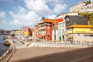 Naklejka na ściany i meble View on the Ribeira promenade with beautiful buildings and Lada chappel in Porto city, Portugal