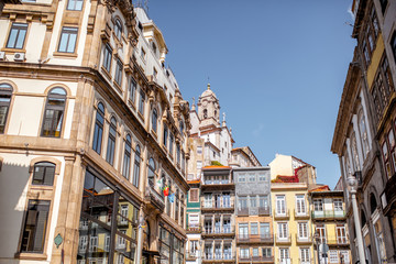 Street view on the beautiful old buildings with portuguese tiles on the facades in Porto city, Portugal