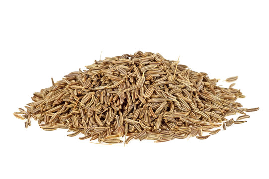Pile of caraway seeds isolated on a white background