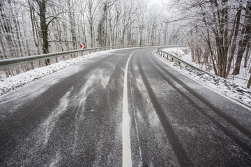 Fototapeta premium snowy road at wintertime