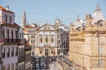 Naklejka premium Cityscape view with Congregados church during the sunny day in Porto city, Portugal