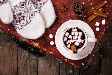 Hot Chocolate with Marshmallow candies. Warming holiday drink with cinnamon sticks . Warm Christmas.Winter Still Life in the Cup.