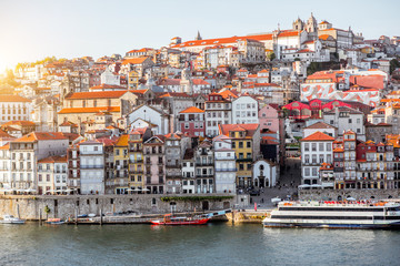 Fototapeta na wymiar Landscape view on the old town on the riverside of Douro river in Porto during the sunset in Portugal