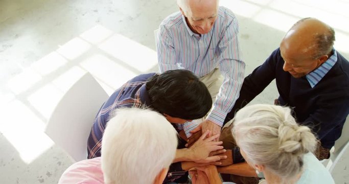 Group of people forming handstack 
