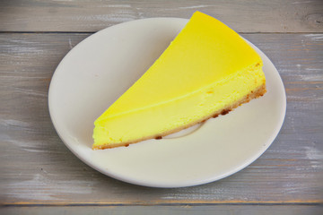 delicious cheesecake with lemon  on  plate