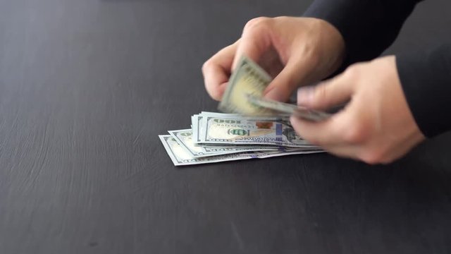 Cash, money, lot of hundred new dollar banknotes. Man counting money, new US dollars. Financial income, wages, sell, loan.