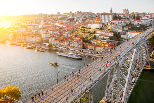 Landscape aerial view on the Luis bridge on the Douro river in Porto city during the sunset in Portugal