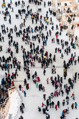 People on the square celebrate Christmas and New Year. In move. Selective focus.