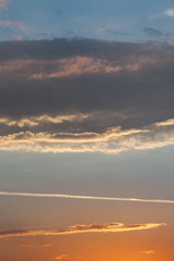 Beautiful sky with couds at the sunset. Copy space. Vertical view