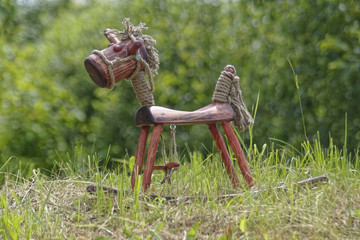 wooden horse on grass