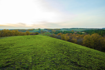 Fototapeta premium The meadow is on top of a long hill.