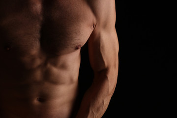 Fototapeta na wymiar Strong Athletic Man muscular body, perfect male abdominal muscles close up.