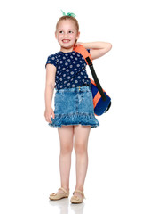 Little girl schoolgirl with flowers