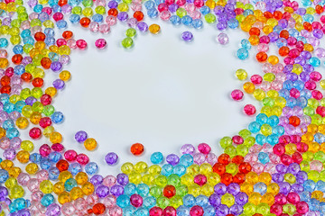 Background of colored beads on a white background
