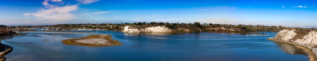 Fototapeta na wymiar Newport Beach back bay panorama view at high tide on a sunny morning