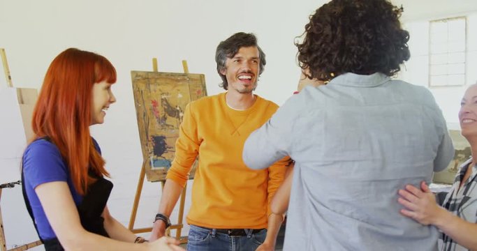 Artists giving high five to each other 