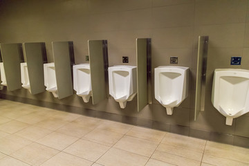 Men's Urinals on a wall