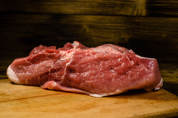 Raw pork meat on cutting board