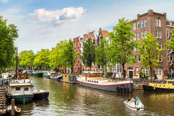 Fototapeta na wymiar Amsterdam canals and boats, Holland, Netherlands.