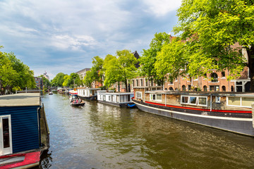 Fototapeta premium Amsterdam canals and boats, Holland, Netherlands.