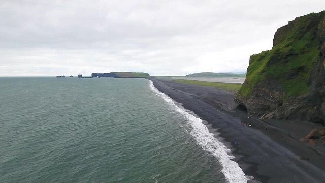 Flying over the famous black sand beach near Vik i Myrdal town in Iceland