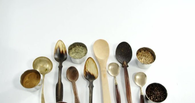 Various type of spoons with spices in bowl 