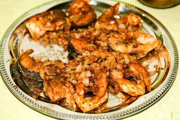 Dish from pieces of fried river fish for dinner in Russia