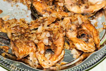 Dish from pieces of fried river fish for dinner in Russia