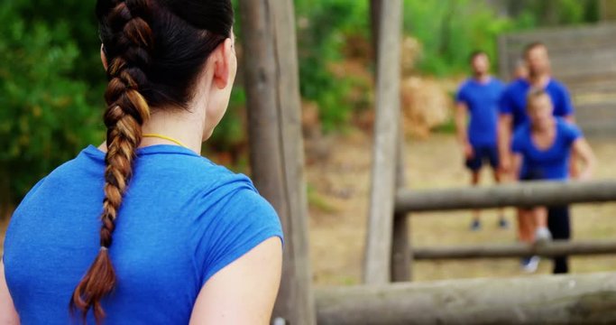 Fit people climbing monkey bars 