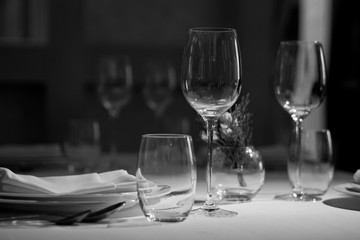Empty glasses wine in restaurant. Glass water. Dish spoon fork on table