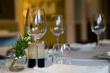 Empty glasses wine in restaurant. Glass water. Dish spoon fork on table