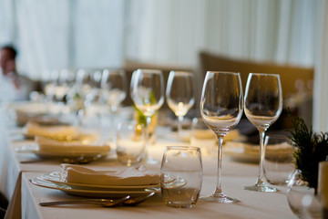 Empty glasses wine in restaurant. Glass water. Dish spoon fork on table