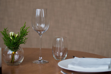 Empty glasses wine in restaurant. Glass water. Dish spoon fork on table