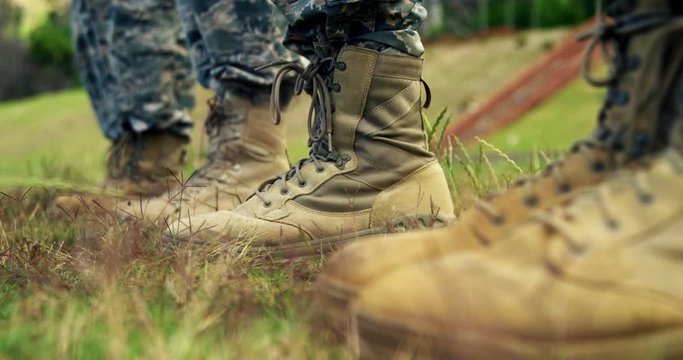 Low-section of military soldiers standing in line 