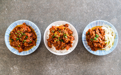 fried pork with spicy korean sauce (bulgogi) on top rice