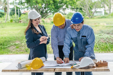 Group of Professional engineer are discussing the project building plan with his business client