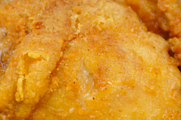 Close Up Chicken Frying In A Pan. Unhealthy Food Concept